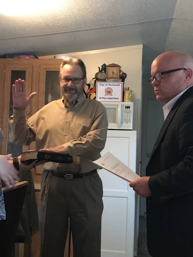 Kenny being sworn in as mayor.